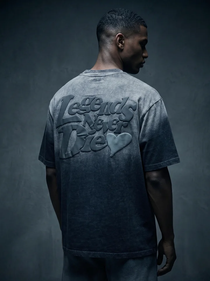 Raised lettering on the back of a washed charcoal Légende Paris tee